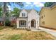 Charming brick house with arched entry and manicured front lawn at 3302.5 Hall Pl, Raleigh, NC 27607