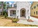 Quaint brick house with an arched entry way and small green bushes at 3302.5 Hall Pl, Raleigh, NC 27607