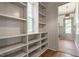 Hallway with gray built-in shelving and view to the front door at 3302.5 Hall Pl, Raleigh, NC 27607