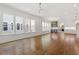 Open-concept living room showcases hardwood floors, plenty of windows, and seamless transition to kitchen at 3302.5 Hall Pl, Raleigh, NC 27607