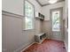Mudroom featuring built-in bench, coat hooks, and patterned tile flooring at 3302.5 Hall Pl, Raleigh, NC 27607