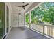 Covered porch with white railing and slat walls, offering a shaded and comfortable outdoor space at 3302.5 Hall Pl, Raleigh, NC 27607