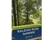 Raleigh Rose Garden sign in a scenic park with trees at 3302.5 Hall Pl, Raleigh, NC 27607