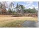 Large backyard featuring a patio and mature trees at 3417 Cardinal Lake Dr, Durham, NC 27704