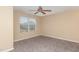 Bright, carpeted bedroom with large window providing natural light at 3417 Cardinal Lake Dr, Durham, NC 27704