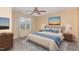 Comfortable bedroom features a ceiling fan, neutral tones, and ample natural light at 3417 Cardinal Lake Dr, Durham, NC 27704