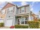 Charming two-story home featuring vinyl siding, shutters, front porch, and attached garage at 3417 Cardinal Lake Dr, Durham, NC 27704