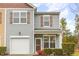 Lovely two-story home with vinyl siding, shutters, and a front-facing attached garage at 3417 Cardinal Lake Dr, Durham, NC 27704