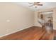 Spacious room featuring hardwood flooring, and a staircase leading to upper level at 3417 Cardinal Lake Dr, Durham, NC 27704