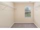 Empty walk-in closet with wire shelving and a window at 3417 Cardinal Lake Dr, Durham, NC 27704