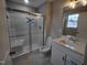 Modern bathroom with a walk-in shower and white vanity at 788 Roberts Rd, Sanford, NC 27332