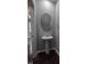 Powder room with pedestal sink and round mirror at 788 Roberts Rd, Sanford, NC 27332