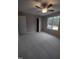 Spacious bedroom with carpet, ceiling fan, and large window at 788 Roberts Rd, Sanford, NC 27332