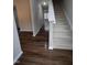 Bright entryway with hardwood floors and staircase leading upstairs at 788 Roberts Rd, Sanford, NC 27332