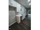 White cabinets and countertops in this galley kitchen at 788 Roberts Rd, Sanford, NC 27332