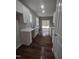 Modern kitchen features white cabinets, quartz countertops, and dark hardwood floors at 788 Roberts Rd, Sanford, NC 27332