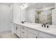 Elegant bathroom showcasing double sinks, ample countertop space, and a tiled shower area behind glass at 800 Heathered Farm Way, Apex, NC 27523