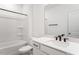 Clean bathroom featuring a shower-tub combo and a modern vanity with a black faucet and bright lighting at 800 Heathered Farm Way, Apex, NC 27523