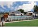 Community pool featuring a modern pool house, lounge chairs, and well-maintained landscaping at 800 Heathered Farm Way, Apex, NC 27523
