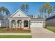 Charming single-Gathering home with a two-car garage, well-manicured lawn, and covered front porch at 800 Heathered Farm Way, Apex, NC 27523