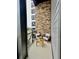 Balcony with stone wall, seating, and view of the surroundings, perfect for relaxation at 120 Mosaic Blvd # 307, Pittsboro, NC 27312