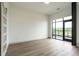 Sun-drenched bedroom with large windows and a private balcony offers serene views and fills the space with natural light at 120 Mosaic Blvd # 307, Pittsboro, NC 27312