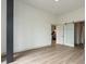 Spacious bedroom with modern barn doors leading to the kitchen and bathroom, creating a stylish and functional layout at 120 Mosaic Blvd # 307, Pittsboro, NC 27312