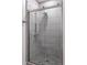 Modern shower boasts sleek glass doors, stylish tile and brushed metal fixtures, offering a spa-like experience at home at 120 Mosaic Blvd # 307, Pittsboro, NC 27312