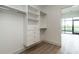 Walk-in closet with built-in shelving and drawers for optimal organization at 120 Mosaic Blvd # 307, Pittsboro, NC 27312