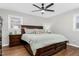 Spacious bedroom with king-size bed and wood furniture at 1394 Frazier Rd, Spring Hope, NC 27882