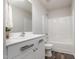 Well-lit bathroom featuring a modern vanity, white countertop, and a shower-tub combination at 2062 Alderman Way, Creedmoor, NC 27522