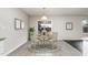This eat-in dining area has views of the back yard and patio access at 2062 Alderman Way, Creedmoor, NC 27522