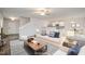 This cozy living room has a ceiling fan and view into the modern kitchen at 2062 Alderman Way, Creedmoor, NC 27522