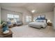 This spacious main bedroom features large windows and a vaulted ceiling at 2062 Alderman Way, Creedmoor, NC 27522