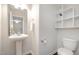 This half bath features modern fixtures and updated finishes at 2062 Alderman Way, Creedmoor, NC 27522
