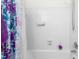 Bright and clean bathroom features a shower-tub combo with white tiled walls at 2169 Northcrest Dr, Elon, NC 27244