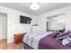 Bedroom with mirrored closet doors, updated lighting, and vinyl wood flooring at 2169 Northcrest Dr, Elon, NC 27244