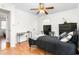 Bedroom with a ceiling fan, hardwood floors, study table and a cozy feel, perfect for unwinding at 2169 Northcrest Dr, Elon, NC 27244