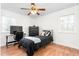 Inviting bedroom with a ceiling fan, hardwood floors, and a comfortable layout for relaxation at 2169 Northcrest Dr, Elon, NC 27244