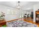 Bright dining room with hardwood floors that connect to an open kitchen at 2169 Northcrest Dr, Elon, NC 27244