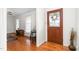 Inviting foyer with hardwood floors and a beautiful wooden door with decorative glass at 2169 Northcrest Dr, Elon, NC 27244