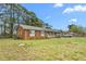 Charming single-story brick home with blue shutters, a covered porch, and a well-maintained lawn at 2169 Northcrest Dr, Elon, NC 27244