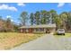 Charming single-story home with brick facade and an attached car port at 2169 Northcrest Dr, Elon, NC 27244