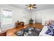 Bright and airy living room featuring hardwood floors, white walls, and ample natural light at 2169 Northcrest Dr, Elon, NC 27244
