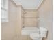 Bathroom featuring a bathtub, shower, and neutral-toned tile at 229 Davis Mill Rd, Selma, NC 27576