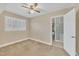 Bedroom with a ceiling fan and neutral-toned walls and carpet at 229 Davis Mill Rd, Selma, NC 27576