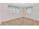 Bedroom with two windows, light-colored walls and carpet at 229 Davis Mill Rd, Selma, NC 27576