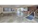 Large carport with concrete floor, brick walls, and wheelchair ramp at 229 Davis Mill Rd, Selma, NC 27576