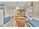 Traditional dining room featuring classic wooden furniture and ample natural light at 229 Davis Mill Rd, Selma, NC 27576