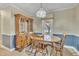 Bright dining room with a vintage hutch and a view of the outdoors at 229 Davis Mill Rd, Selma, NC 27576